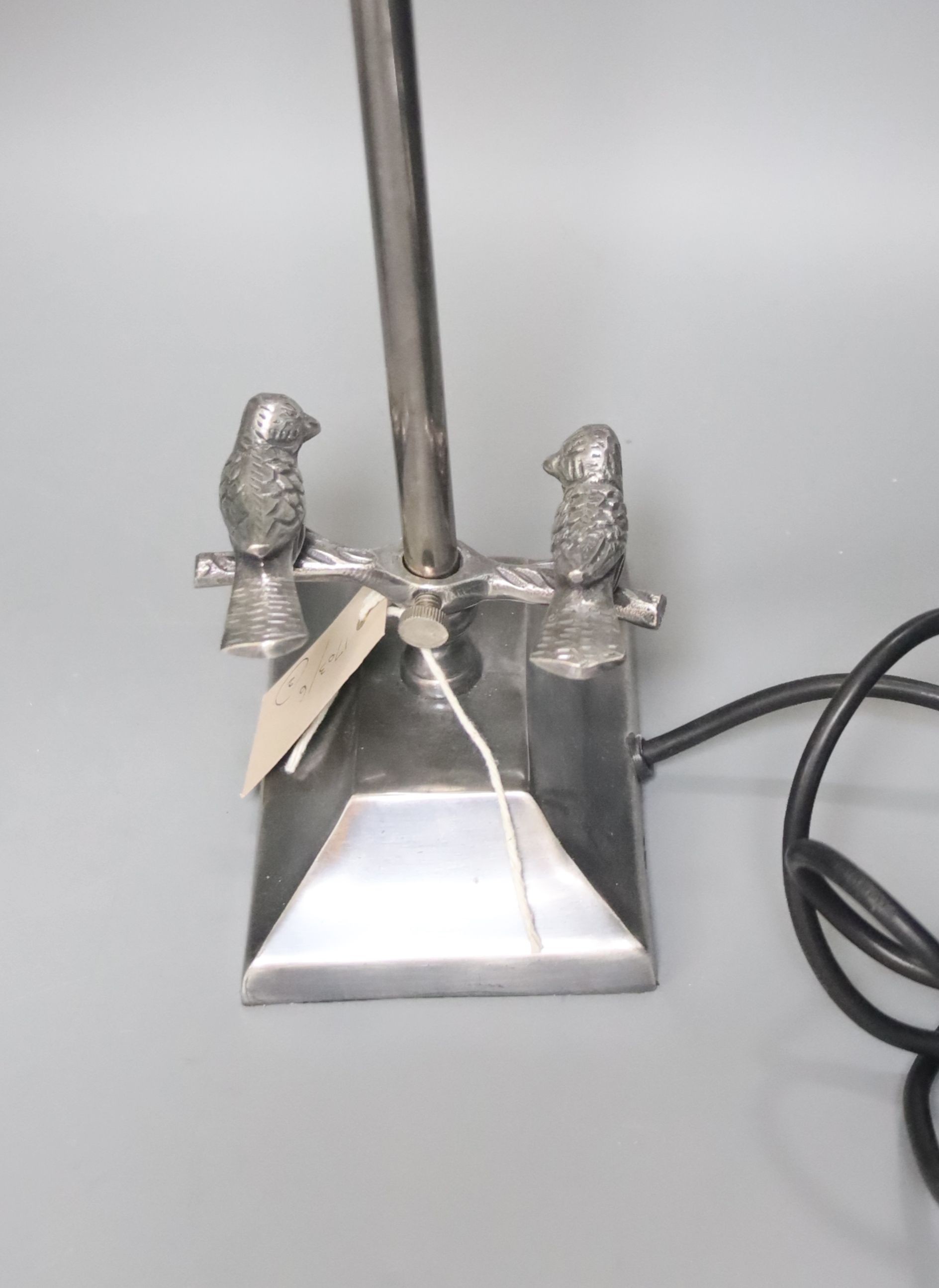 A bronze table lamp with mottled brown glass fitting and a chromed adjustable lamp